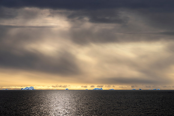 Blue icebergs in a far distance, North East  Svalbard